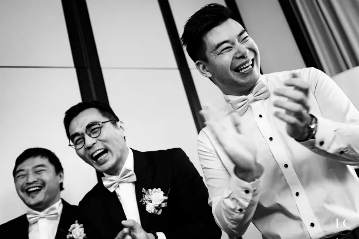 Guests laughing at wedding