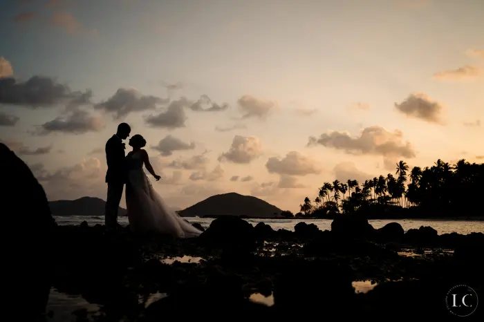 Bride and groom shadows sunset beach